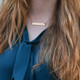 Custom gold bar necklace personalized with your actual handwriting, shown on a model