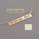 Gold bar necklace with child's actual handwritten note to Mom, created from 2 separate pieces of writing. Shown with the original handwriting used to personalize it