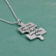 Custom handwriting puzzle charm in silver, shown from side