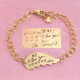 Gold memorial handwriting angel wing bracelet, personalized with your loved ones actual handwriting, showing the original handwritten note