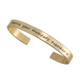 Gold handwriting cuff remembrance bracelet, with passed loved one's actual handwritten note on the outside, shown on white