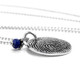 Side view of custom sterling silver fingerprint necklace personalized with an actual fingerprint engraved on it, with a blue birthstone