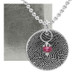 Custom sterling silver disc fingerprint necklace engraved with your actual fingerprint, with a red birthstone, shown with the original fingerprint used to personalize it