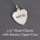 Hand stamped 1/2" sterling silver heart charm stamped in Kissme Upper Case font with kid's name "Katie"