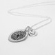Custom silver fingerprint necklace, with silver heart charm, shown from the side