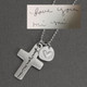 Custom silver Handwriting Cross Necklace, personalized with handwritten note Love You Mi Mi, shown from top 
close up, with original handwriting