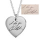 Custom silver heart necklace, engraved with husband's handwritten signature, shown on white with the handwriting used to personalize it