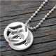 Custom Angel Charm and Name Disc Necklace, personalized with hand stamped name, shown from the side
