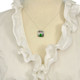 Model wearing handmade sterling silver Irish Celtic Knot necklace with green briolette stone