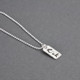 Dainty Custom Silver Handwriting Tag necklace, personalized with loved one's signature "Rick", shown from the side