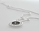 Side view of custom silver Etched Forever Love moon and back necklace