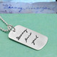 Custom silver dog tag necklace with handwritten note from Grandma, with the original handwritten note used to create it