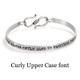 Custom stamped Inspiration Bracelet in Sterling Silver personalized with message in Curly Upper Case font, saying "Difficult roads often lead to beautiful destinations"