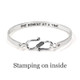 Personalized sterling silver bracelet, hand stamped with inspirational message on the inside, shown from the back on a white background