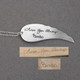 Large Handwriting Memorial Charm Angel Wing in silver, with a silver puffed heart, shown close up, with the original handwriting used to create it