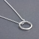 Side view of custom silver Mini Forever Love Circle Necklace, personalized with Grandfather's name and birthdate