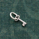 Silver Mini Key charm to add to bracelets and necklaces