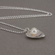 Silver Mom Heart with Pearl hand stamped custom necklace, shown from the side