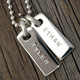 Custom silver rectangle pendants, personalized with kids' names Ethan and Tyler hand stamped on the charms, with the letters left unblackened