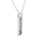 Side view of custom hand stamped Rectangle Warmth Necklace, with the silver rectangle charm personalized with son's name "Ethan", and stamped with footprints
