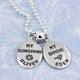 Sterling silver oval charms, personalized with hand stamped names Oliver & Eden, and a hand stamped sun & bird symbols