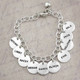 Hand stamped sterling silver custom bracelet for grandma, stamped with lots of grandkids' names