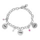 Hand stamped sterling silver custom mom bracelet, stamped with kids' names, with matching birthstones for each child, shown on white