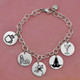 Hand stamped sterling silver custom bracelet with cute image stamps on each disc