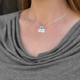 Personalized Sterling Circles of Affection, custom hand stamped silver charms with kids names, with a silver spacer bead, shown with a snake chain on a model