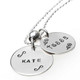 Our 3/4" and 5/8" sterling hand stamped name discs. "Kate" in Block Upper font on the 3/4" charm, and "tessa" in Lower Kissme font on the 5/8" charm