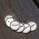 vintage style sterling silver circles with raised edges, hand stamped with names , shown from the top