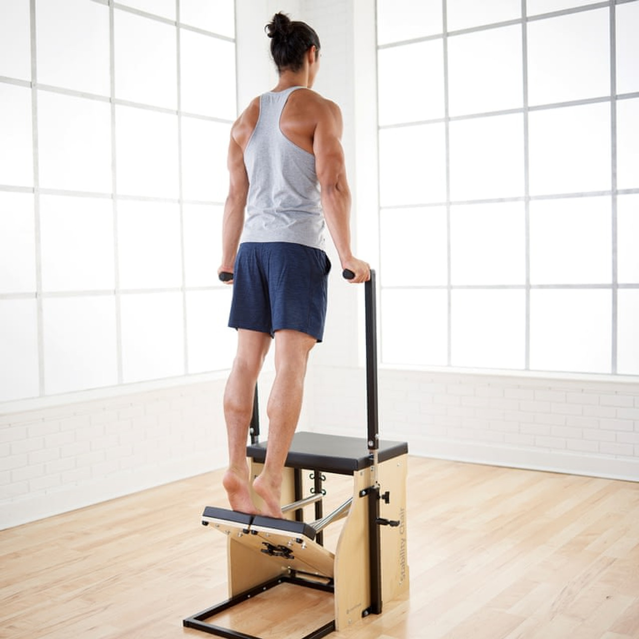 Exercise of the Month  STOTT PILATES® Rehab: Crossover Press on Stability  Chair™ 