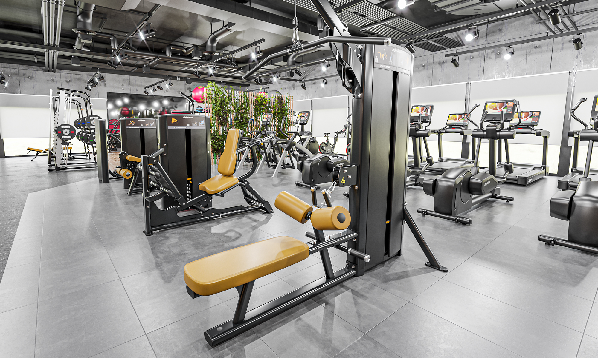 A gym filled with lots of equipment including a leg extension machine - image