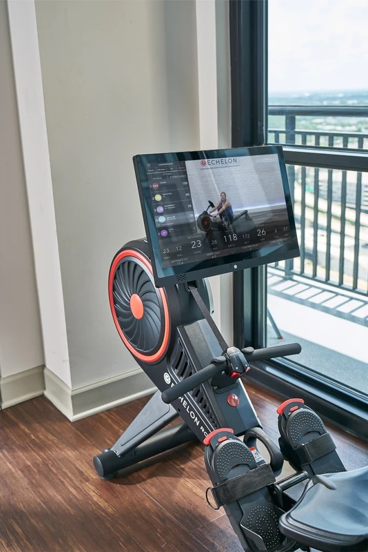 A rowing machine with a screen that says echelon on it - image
