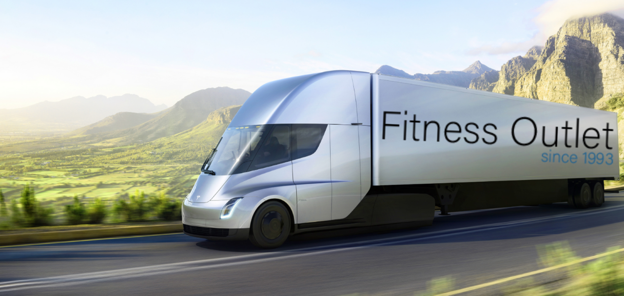 A truck that says fitness outlet on the side of it - image