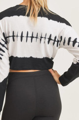 This long-sleeve top features wavelength tie-dye pattern in the center, flanked by white and black that wrap around the body and the sleeves.