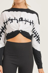 This long-sleeve top features wavelength tie-dye pattern in the center, flanked by white and black that wrap around the body and the sleeves.