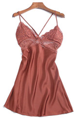 This beautifully draped slip dress features delicate eyelash lace trip at bust and neckline and criss cross back.