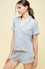 Button front short sleeve notched lapel pajama top with contrast piping with matching shorts.