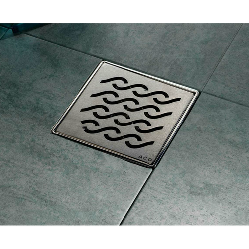 ACO Q- Plus Point Drain installed with wavy stainless steel grate
