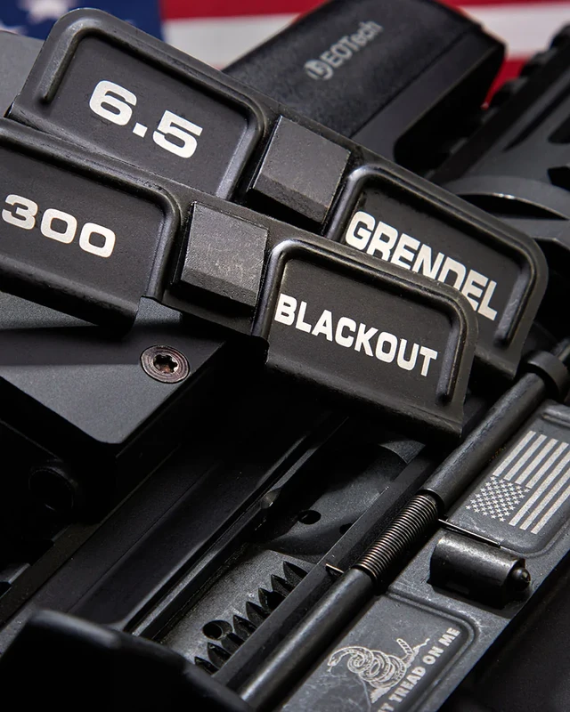 Laser engraved AR-15 dust covers marked 6.5 Grendel and 300 Blackout