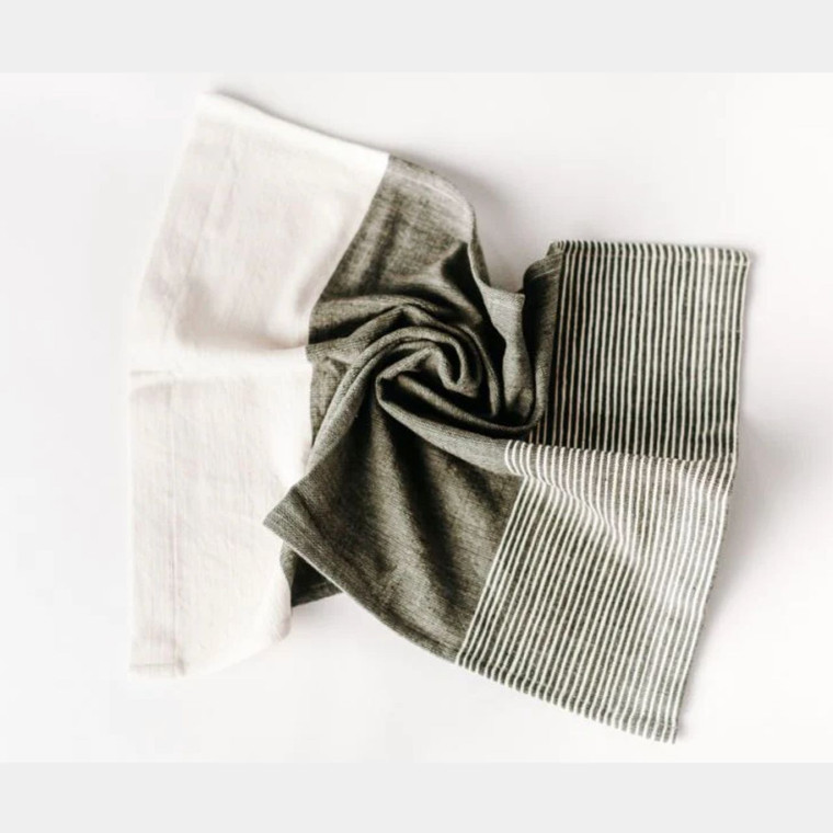 Handwoven cotton tea towel in classic white and grey. Ideal for adding textural interest and a touch of understated elegance to any kitchen design.