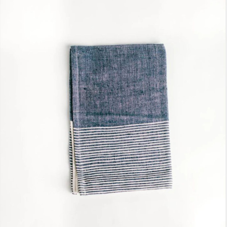 Handwoven cotton kitchen towel in a beautiful blue and white colorway. Perfect for adding a touch of artisanal charm and textural interest to any kitchen design.