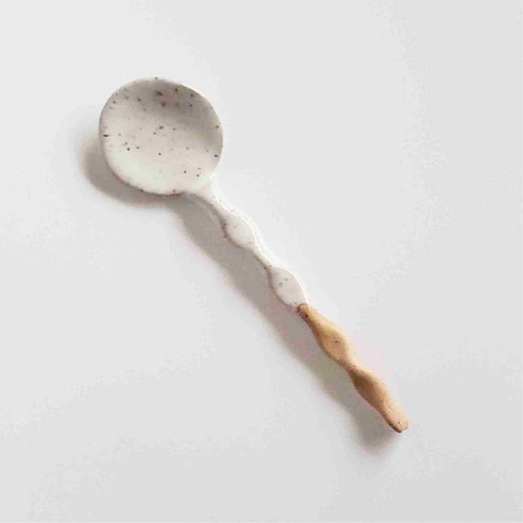 Handcrafted ceramic coffee spoon in white and beige, made on a pottery wheel by an American artisan.