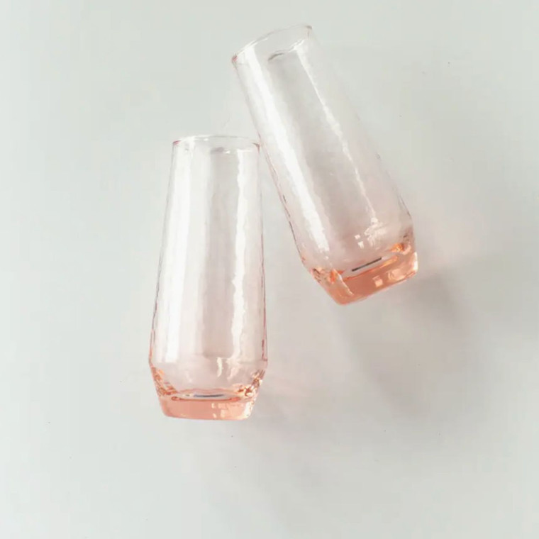 Stemless champagne flute with hand-hammered texture and subtle colored glass, ethically crafted from recycled glass