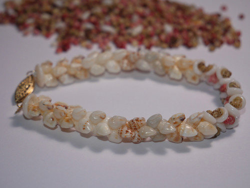7 1/2" blue, yellow, brown spotted, white Momi, pink, green Kahelelani and Puka plumeria style shell bracelet #274