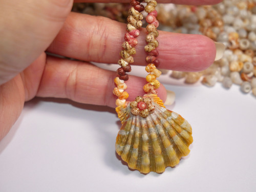 19 1/4" light green yellow, gray Sunrise shell centerpiece with yellow, burgundy, green, pink Kahelelani shells necklace #1065 19 1/4" light green yellow, gray Sunrise shell centerpiece with yellow, burgundy, green, pink Kahelelani shells necklace #1065
