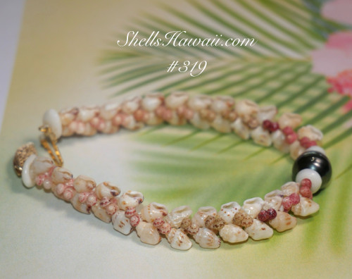 Niʻihau shell bracelet — 7″ herringbone design featuring colorful Kahelelani shells with a cone shell accent, handcrafted Hawaiian jewelry Niʻihau shell bracelet — 7″ herringbone design featuring colorful Kahelelani shells with a cone shell accent, handcrafted Hawaiian jewelry
