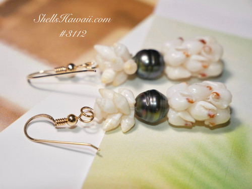 1½″ Pineapple-Inspired Niʻihau shell earrings handcrafted with bright white Momi shells accented by red waha detailing and topped with a peacock-tone Tahitian pearl. Tropical elegance in a petite form. 1½″ Pineapple-Inspired Niʻihau shell earrings handcrafted with bright white Momi shells accented by red waha detailing and topped with a peacock-tone Tahitian pearl. Tropical elegance in a petite form.