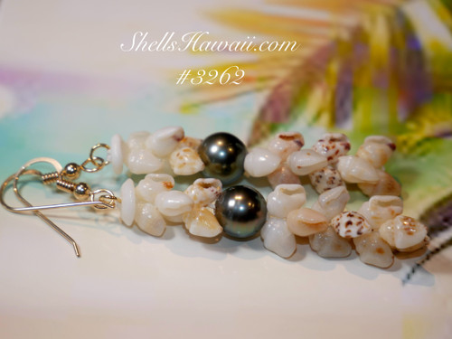 2″ Pikake style Niʻihau shell earrings featuring yellow Lenalena, white Keʻokeʻo, dark brown-spotted ʻŌnikiniki ʻĀhiehie, blue ʻUliʻuli, and rare purple Momi shells, paired with a peacock-tone Tahitian pearl. 2″ Pikake style Niʻihau shell earrings featuring yellow Lenalena, white Keʻokeʻo, dark brown-spotted ʻŌnikiniki ʻĀhiehie, blue ʻUliʻuli, and rare purple Momi shells, paired with a peacock-tone Tahitian pearl.